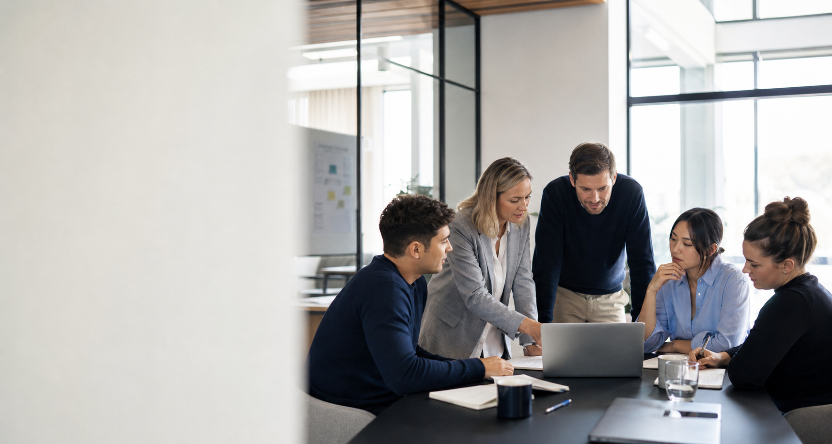 Technology professionals collaborating in a bright office meeting
